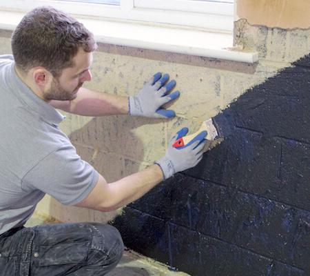 Applying damp proof paint