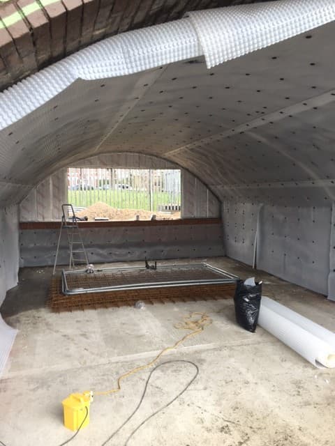 partially converted railway arch with cavity drain membrane installed and visible