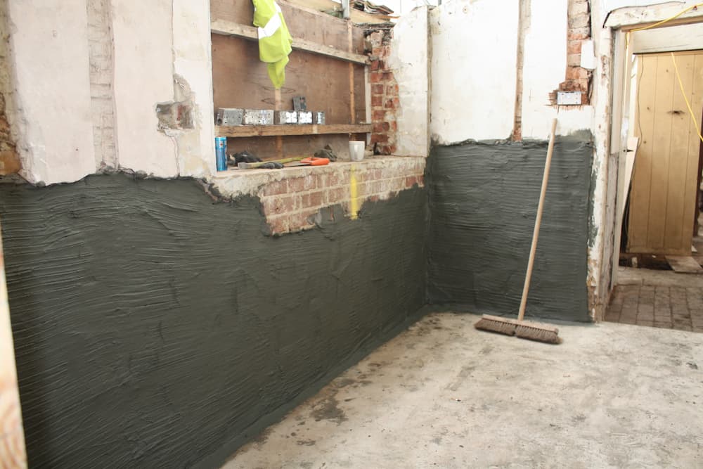Wall with freshly applied tanking slurry applied, ready for plaster